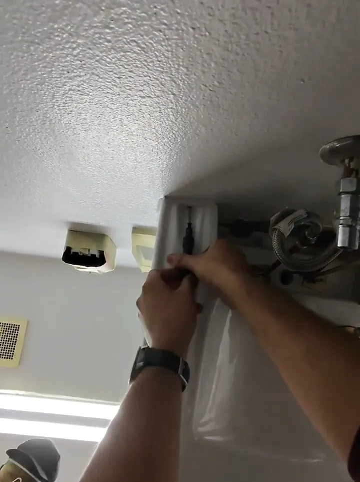 On-site photo of the contractor installing restroom ceiling drain for a Federal Way plumbing visit.