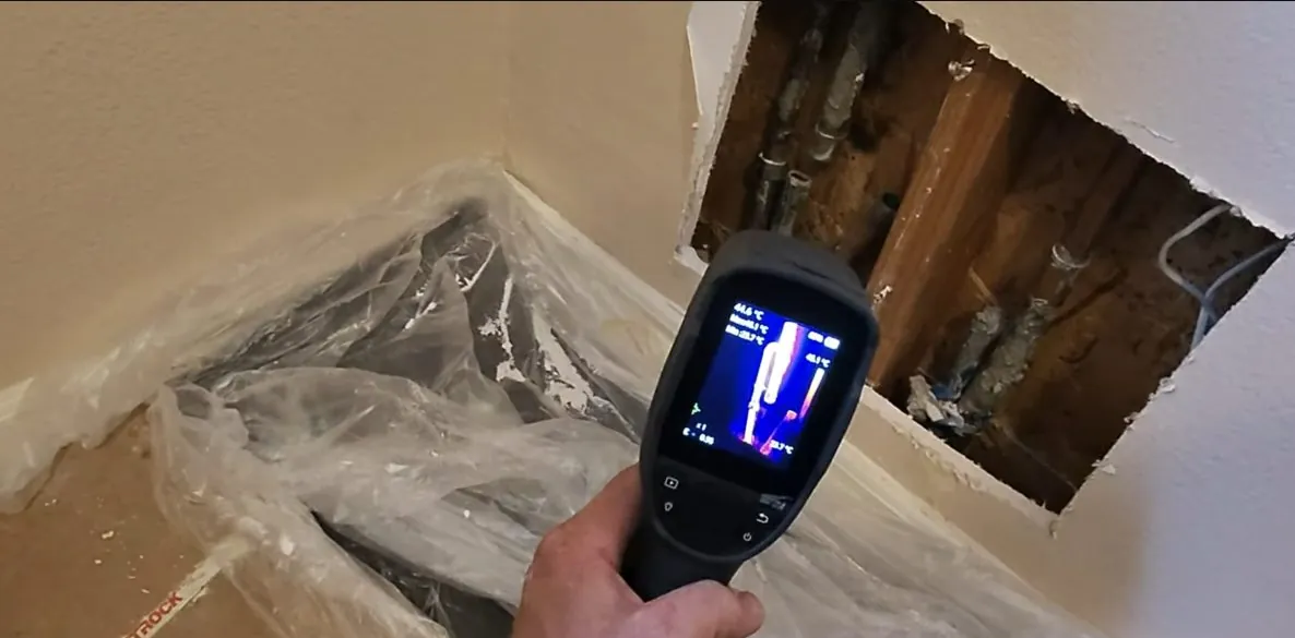 The digital leak detector screen over floor, part of a Federal Way area plumbing repair.